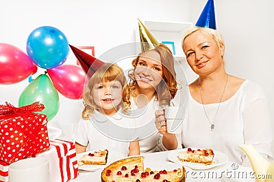 Happy birthday with little girl mother and granny Stock Photo