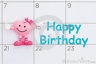 Happy Birthday reminder date on a calendar with a happy smiling heart Stock Photo