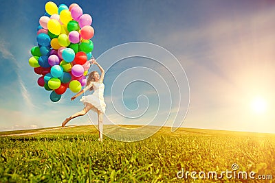 Happy birthday woman against the sky with rainbow-colored air ba Stock Photo