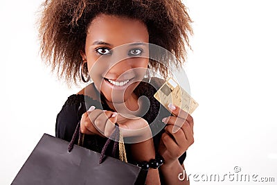 Happy black girl with shopping bags, credit card Stock Photo