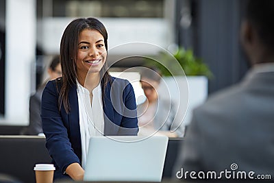 Happy black woman meeting with business partner Stock Photo