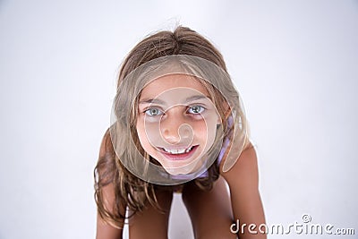 Happy blond girl looking at the camera from front Stock Photo