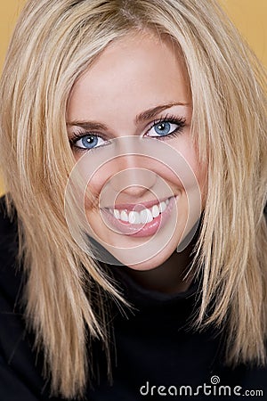 Happy Blond Woman With Perfect Teeth and Smile Stock Photo