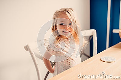 Happy blonde baby girl at home Stock Photo