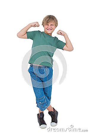 Happy blonde boy tensing arm muscles Stock Photo