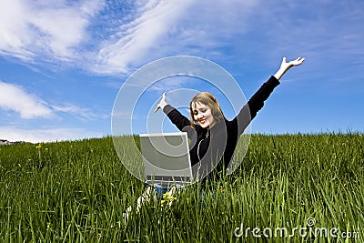 Happy blonde with laptop Stock Photo