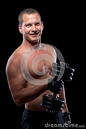 Happy bodybuilder with dumbbell Stock Photo