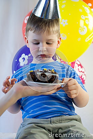 Happy boy eat birthday cake Stock Photo