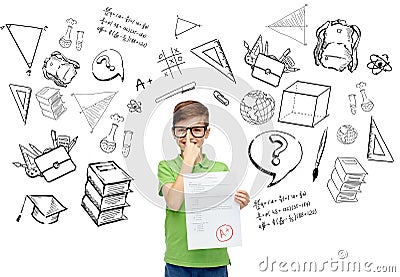 Happy boy in eyeglasses holding school test result Stock Photo