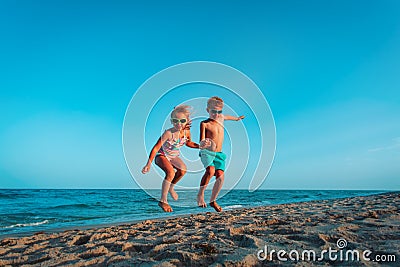 Happy boy and girl enjoy beach, kids play on sea vacation Stock Photo