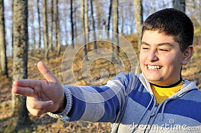 Happy boy giving make your hand gun Stock Photo