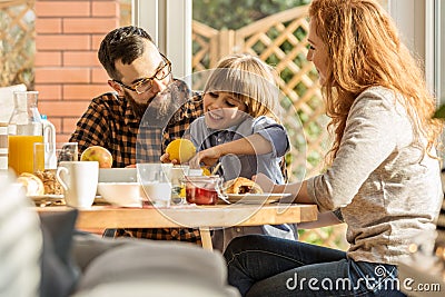 Lovely family eating breakfast Stock Photo