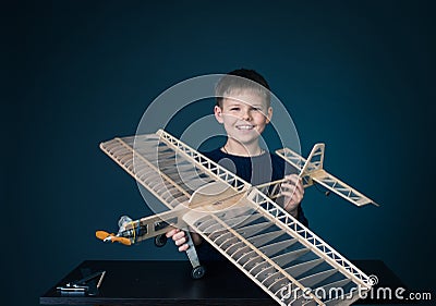 Happy boy holding the model airplane Stock Photo