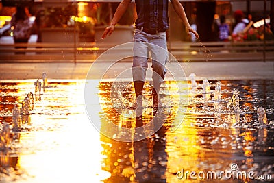 Happy boy jump on water Philadelphia city fountain Stock Photo