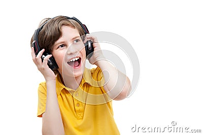 Happy boy listens music with modern headphones Stock Photo