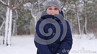 Happy Boy In Navy Jacket Play With Snow And Throw It Up To ...