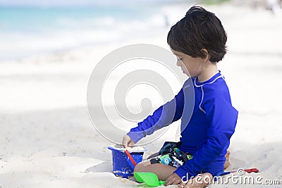 Happy Boy Playing at the beach Stock Photo