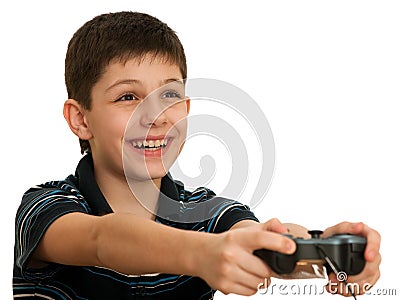Happy boy playing a computer game with joystick Stock Photo