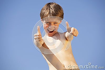 Happy boy posing thumbs up Stock Photo