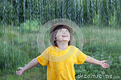 Happy boy in rain summer Stock Photo