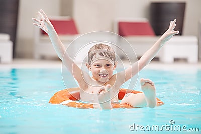 Happy boy swiming in pool Stock Photo