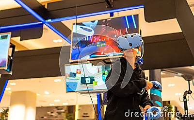 Asian people using VR for watch and play game Stock Photo