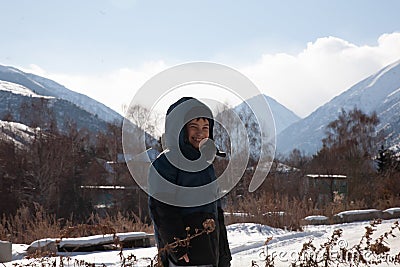 happy boy walking in sunny mountains children's clothing for the mountains close smiling portrait Stock Photo