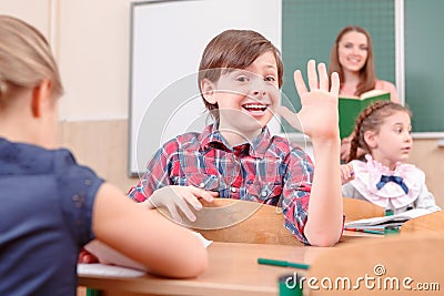 Happy boy waving with hand Stock Photo