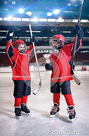 Happy boys players ice hockey winner trophy Stock Photo