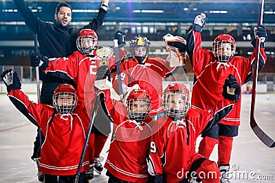 Happy boys players team ice hockey winner trophy Stock Photo