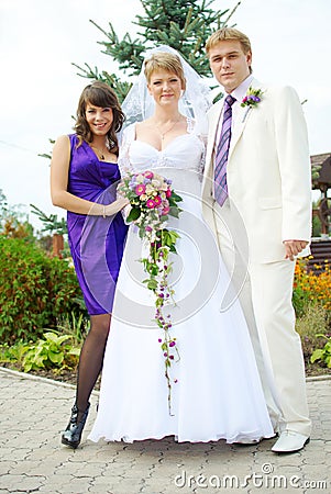 Happy bridal party outside during a wedding Stock Photo