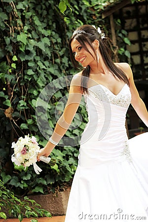 Happy bride holding a bouquet Stock Photo
