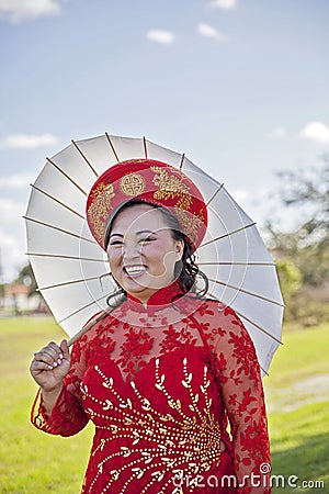 Happy bride wearing Vietnamese Ao Dai Stock Photo