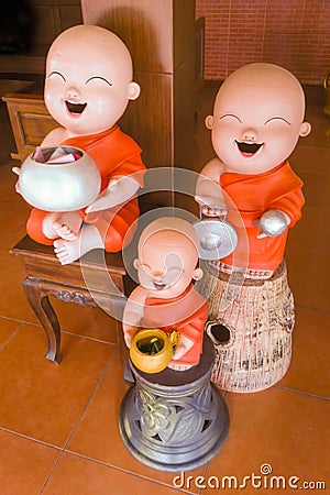 Happy Buddhist novice earthenware. Stock Photo