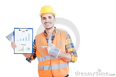 Happy builder pointing finger on clipboard sales chart Stock Photo