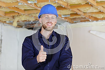 happy builder with thumb up Stock Photo