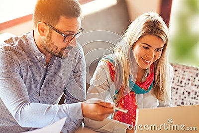 Happy business couple working together Stock Photo