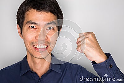 A happy business man beated an achievement.portrait winner handsome guy. portrait of a man with successful feeling Stock Photo