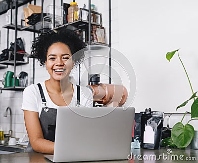 Happy business owner standing at counter Stock Photo