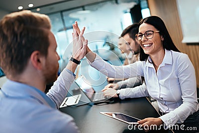 Happy business people achieving success Stock Photo