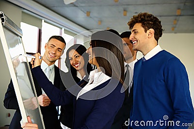 Happy business team with flip board Stock Photo