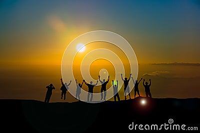 Happy business team silhouette sunrise Stock Photo