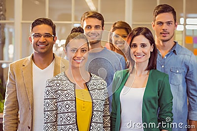 Happy business team smiling at camera Stock Photo