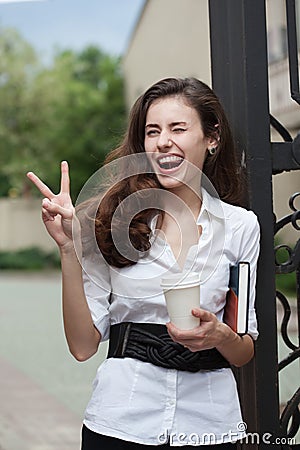 Happy business woman with coffee and notebook Stock Photo