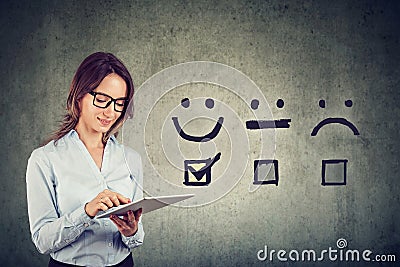 Happy business woman giving excellent rating for online satisfaction survey Stock Photo