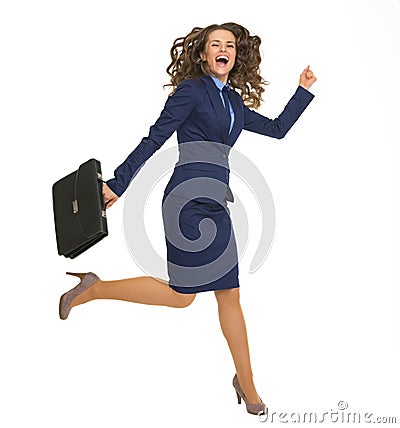 Happy business woman jumping with briefcase Stock Photo