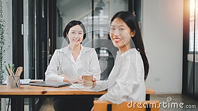 Happy business woman smiling face and happiness while discussing data in the office Stock Photo