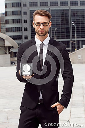 Happy Businessman with award Stock Photo