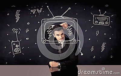 Happy businessman drawing tv and radio Stock Photo