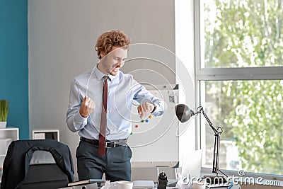 Happy businessman finishing his job in time Stock Photo